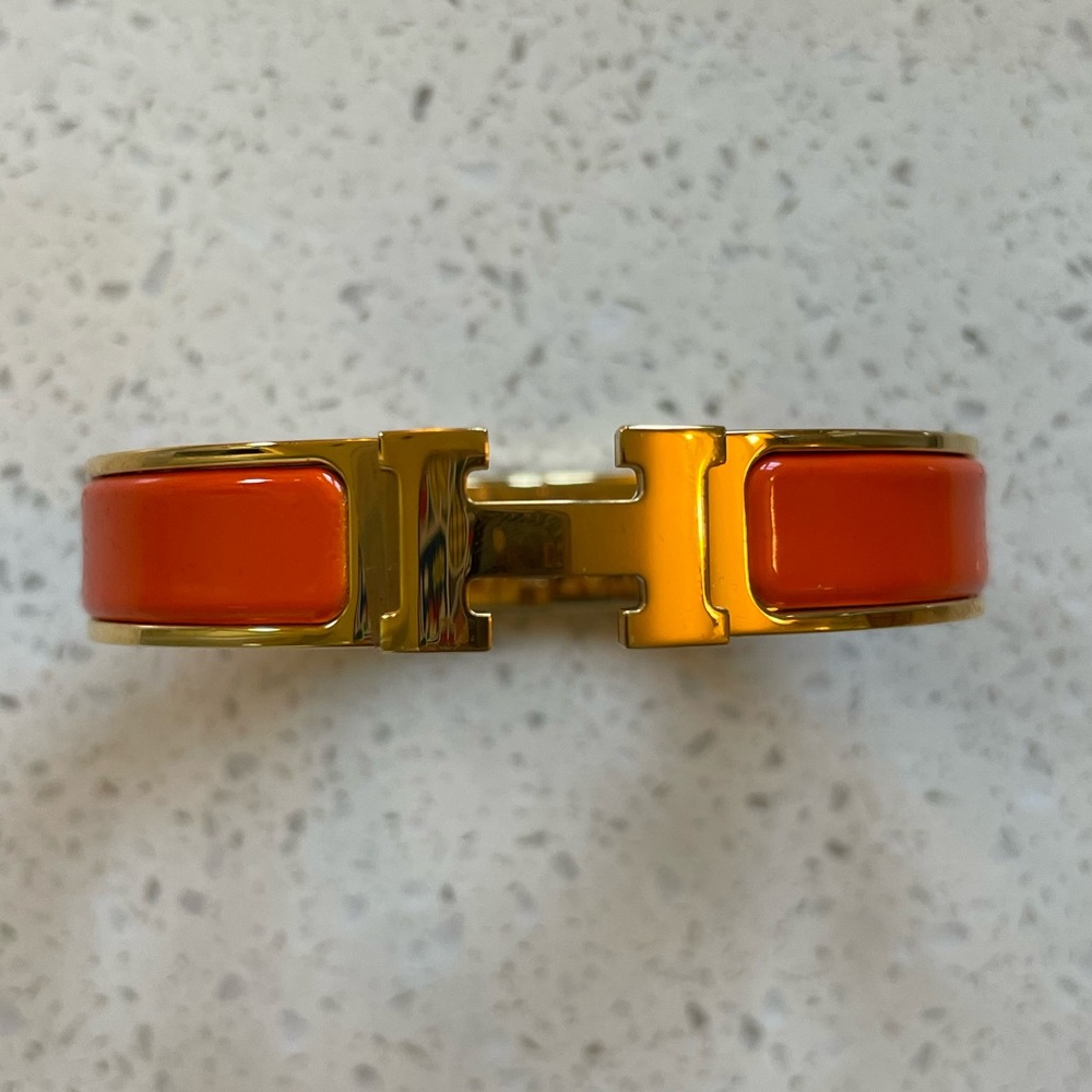 Hermes Clic H bracelet with orange enamel and yellow gold hardware
